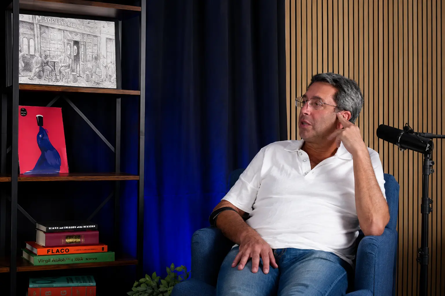 A guest reflecting during a conversation in the VIRGO recording studio